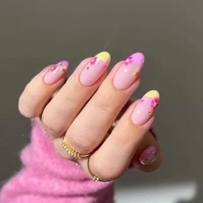 A pink and yellow French manicure