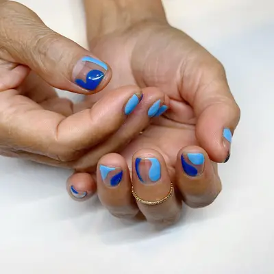 Dark and Baby Blue Swirl Nails