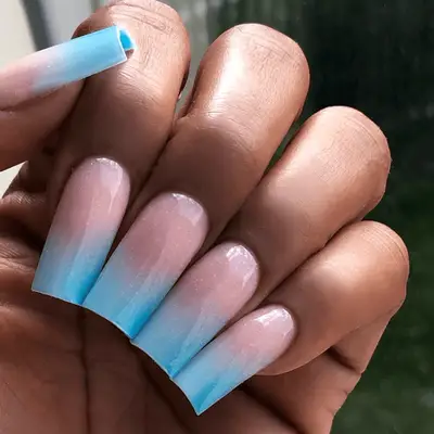 Almond shaped nails with blue chrome polish