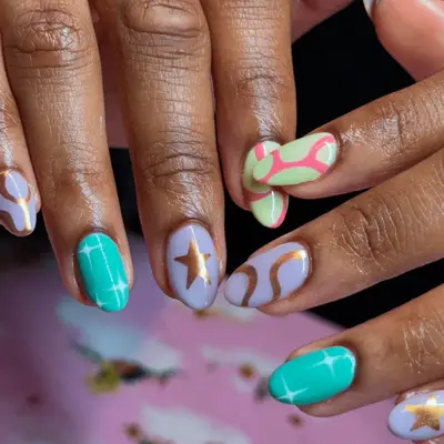 mismatched manicure with chrome accents