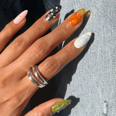 mismatched manicure with chrome accent nail
