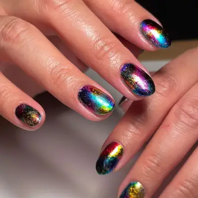 a short rainbow chrome manicure