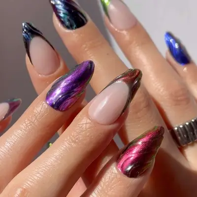 a manicure in dark chrome colors with 3D nail art