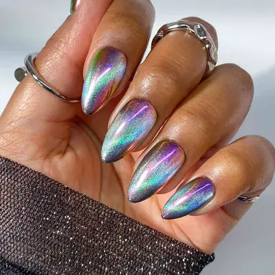 a cat-eye manicure in oil-slick tones