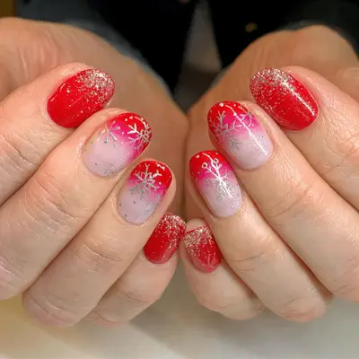 Blue velvet manicure with pink accent nails with white snowflakes