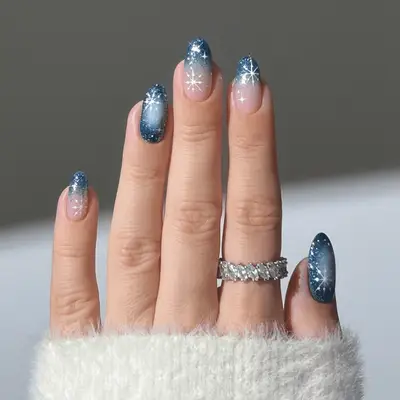 Pink and silver shimmer manicure with white snowflake nail designs