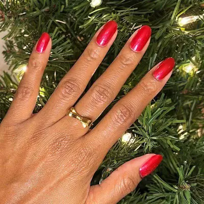 Hand Wearing Winter Nail Colors Classic in Cherry Red