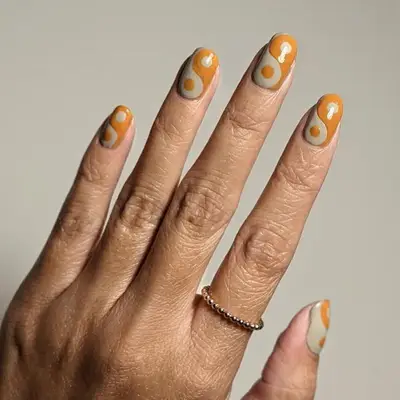 Hand Wearing Winter Nail Colors in Mustard Yellow