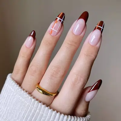 French manicure with plaid accents