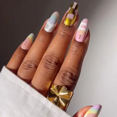 a mismatched manicure in pastel shades