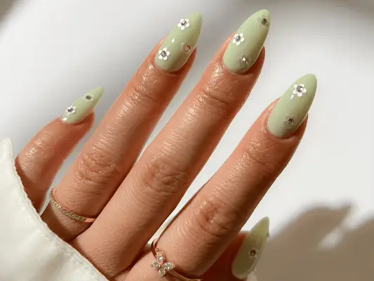 pistachio green nails with floral accents