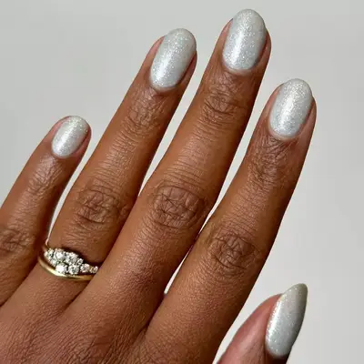 Model with silver metallic nails