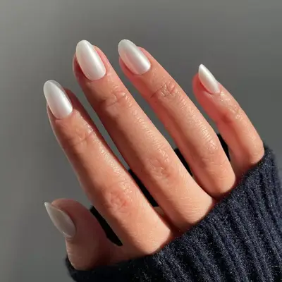 Model with white pearl nails