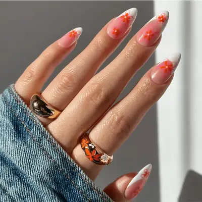 french tips with stencil-like pink flower design