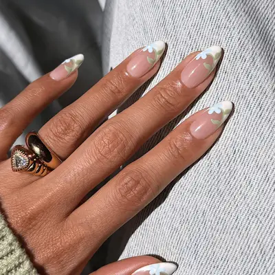 french tips with small blue flower design