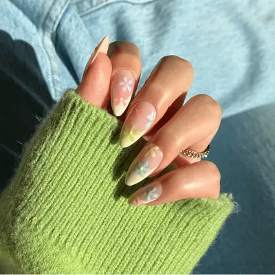 pale yellow french tips with colorful daisy flower design