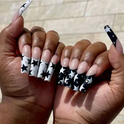 Black and white inverted stars on French tips