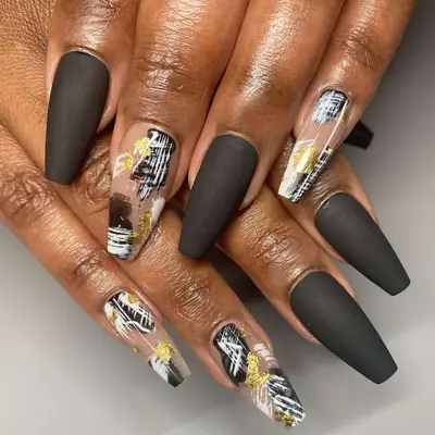 Matte black nails with splash of yellow and cold 