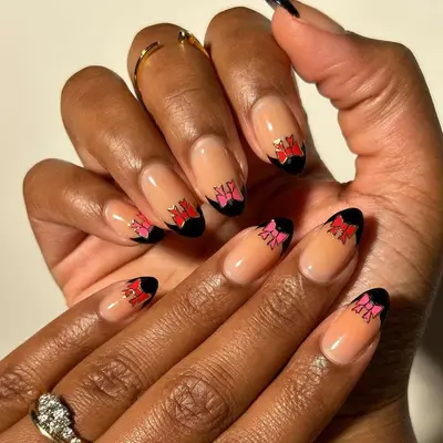 Black French tips with pink and red bows 