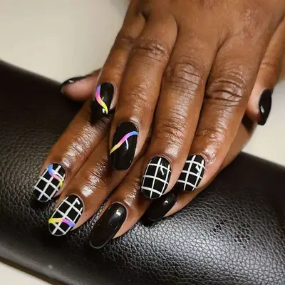 Black nails with checkered grid and pops of color