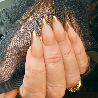 Jennifer Coolidge wearing Gold French manicure