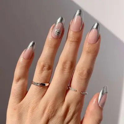 Silver foil French manicure with disco ball accent on the ring nail - MYM Beauty Festival Nails