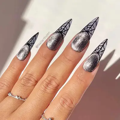 a silver velvet manicure with spider web french tips