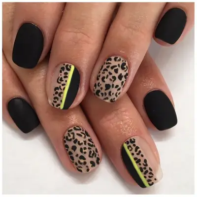 Matte black nails with leopard print