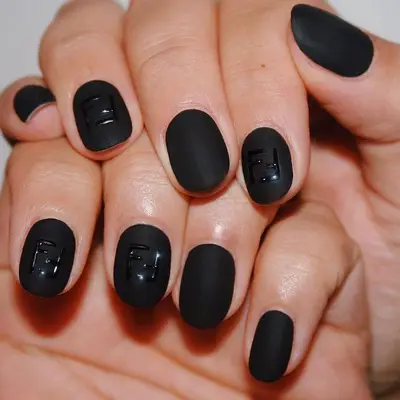 Matte black nails with Fendi logo