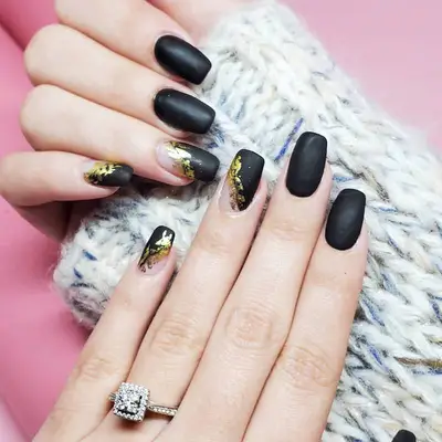 Matte black nails with gold foil