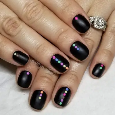 matte black nails with neon dots