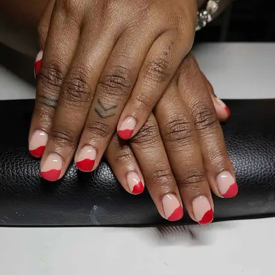 red asymmetrical French tip nails 