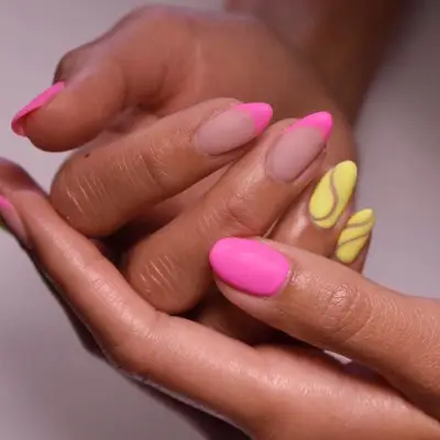 mismatched neon pink and yellow manicure in matte finish
