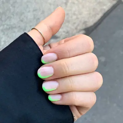 Nude nails with neon green edges
