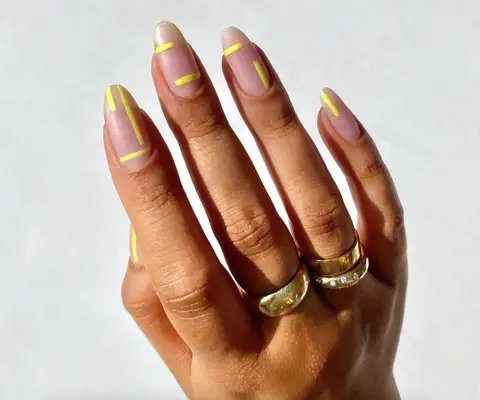 Matte nude nails with abstract neon yellow line art