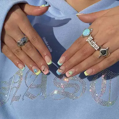 pastel french manicure with smiley face stickers