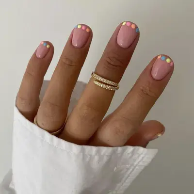 French manicure with pastel dotted tips