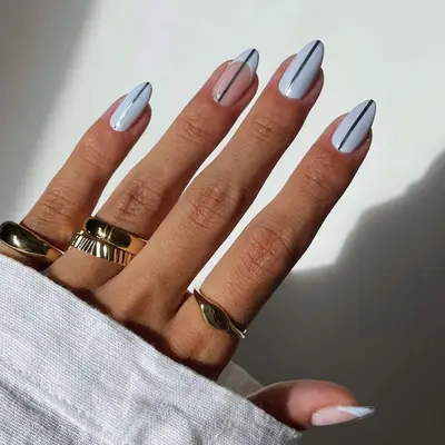 periwinkle nails with metallic stripe down the middle