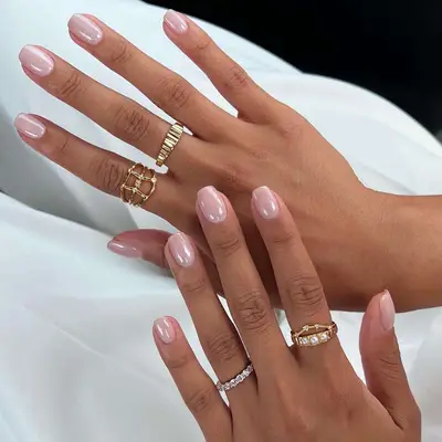 Pastel pink manicure with glossy glazed finish