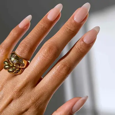 Translucent neutral manicure with glossy finish