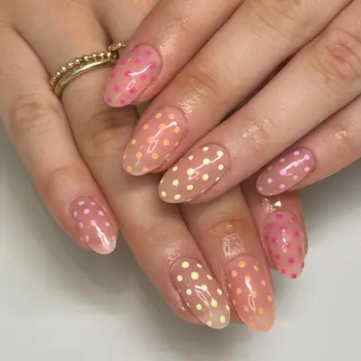 Multicolored polka dot nails. 