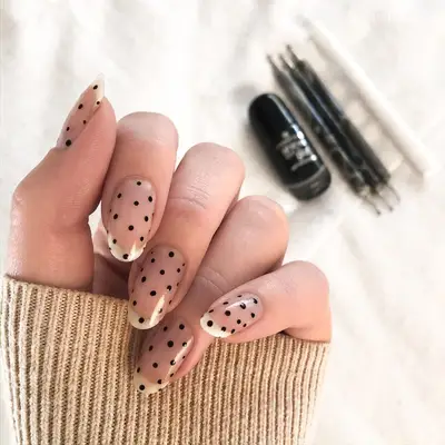 Negative space polka dot nails. 