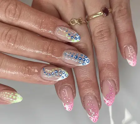 Mismatched polka dot nails.