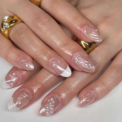 Decorative manicured nails with intricate white designs