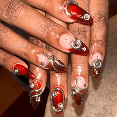 Amber jelly nails with chrome 3D gems.