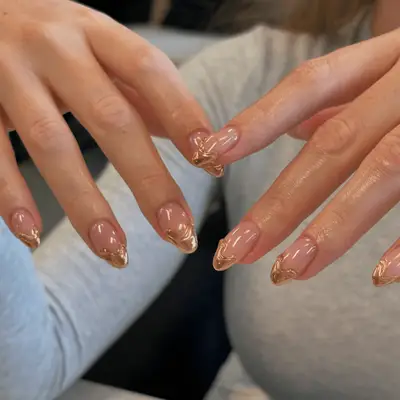 French manicure with shimmering pink base and charcoal chrome tips