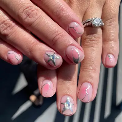 Short nails with silver chrome designs