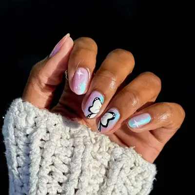 Manicure with shimmery colors and butterfly nail art