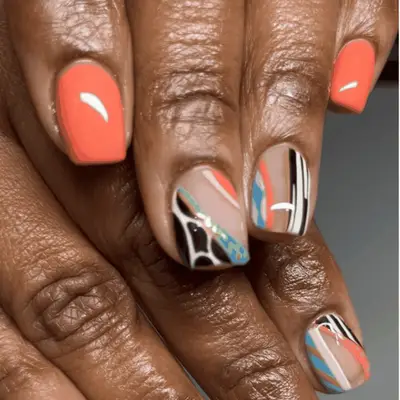 Short nails with rainbow colored tips and bases