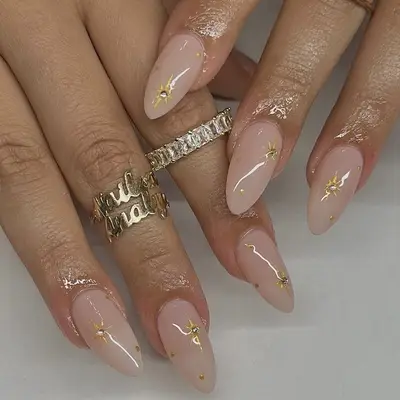 nude pink gold sparkle nails closeup